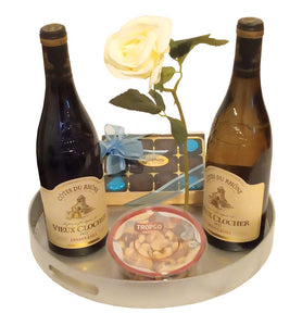 KOSHER BADATZ RED AND WHITE FRENCH WINE WITH CHOCOLATES, NUTS AND A ROSE IN A SILVER METALLIC REUSABLE ROUND TRAY. IDEAL FOR AUFRUF, MAZEL TOV, ENGAGEMENT, PURIM, PESACH AND SHABBAT. DELIVERED FREE NATIONWIDE.