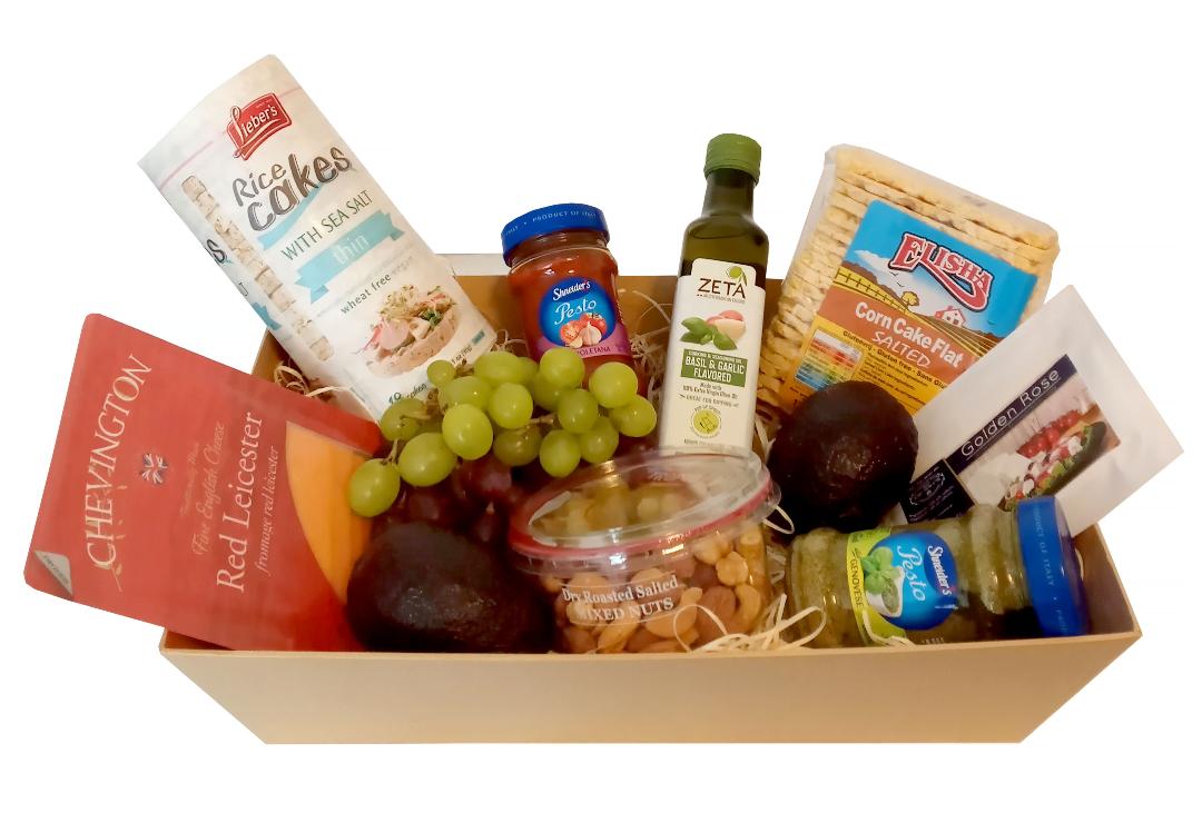 Mishloach Manot Purim Gluten Free Kosher Gift Box. With Three Varieties Of Cheese: Goat's Cheese, Cream Cheese And Red Leicester With Pestos, Avocadoes, Grapes, Nuts, Rice Cakes, Corn Flat Crackers And Flavoured Olive Oil.  Delivered London.